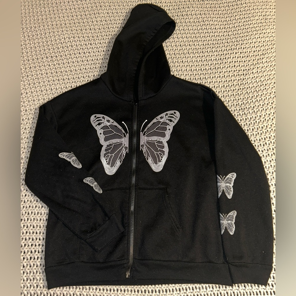 black zip up jacket with white butterfly design